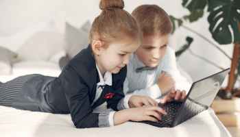 boy and girl studying happily
